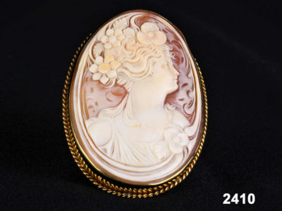 Front view of Large beautifully carved cameo brooch / pendant in a 9 carat gold frame from Antiques of Kingston