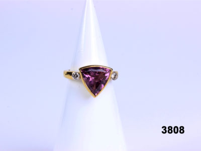 Front view of 18 carat gold ring with trillion cut pink tourmaline and diamonds from Antiques of Kingston