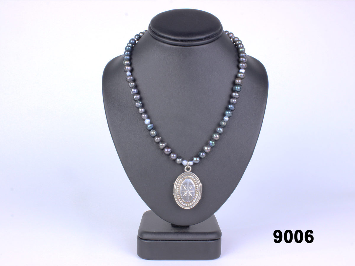 Handmade black freshwater pearl necklace with a French silver locket from Antiques of Kingston