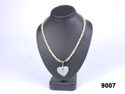 Faux pearl necklace with a dyed agate heart pendant from Antiques of Kingston
