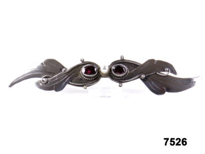 Front view of vintage silver brooch with garnet & pearl from Antiques of Kingston