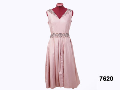 Front view of Vintage handmade dusky pink ball gown with bead detail around neck & waist from Antiques of Kingston