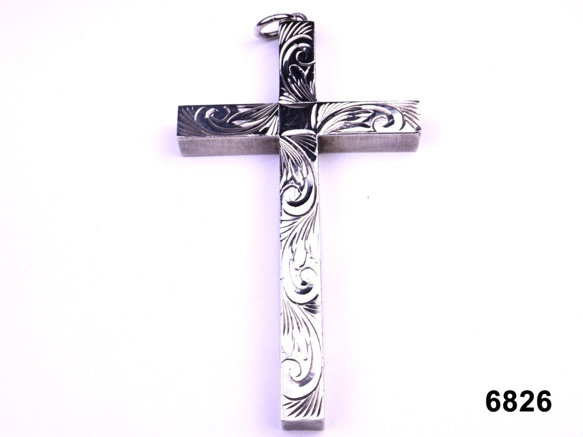Front view of c1975 Birmingham assayed sterling silver cross pendant with decorative scroll work from Antiques of Kingston.