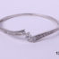 Front view of 925 Sterling silver bangle with graduated cubic zirconia stones from Antiques of Kingston.