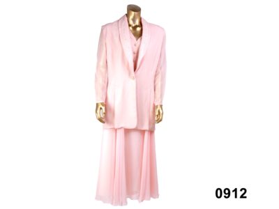 Pale pink evening suit consisting of maxi skirt and jacket with lightly padded shoulders and sewn-in waistcoat by Vasilia of London from Antiques of Kingston Size 12 100% Polyester / Hand wash only
