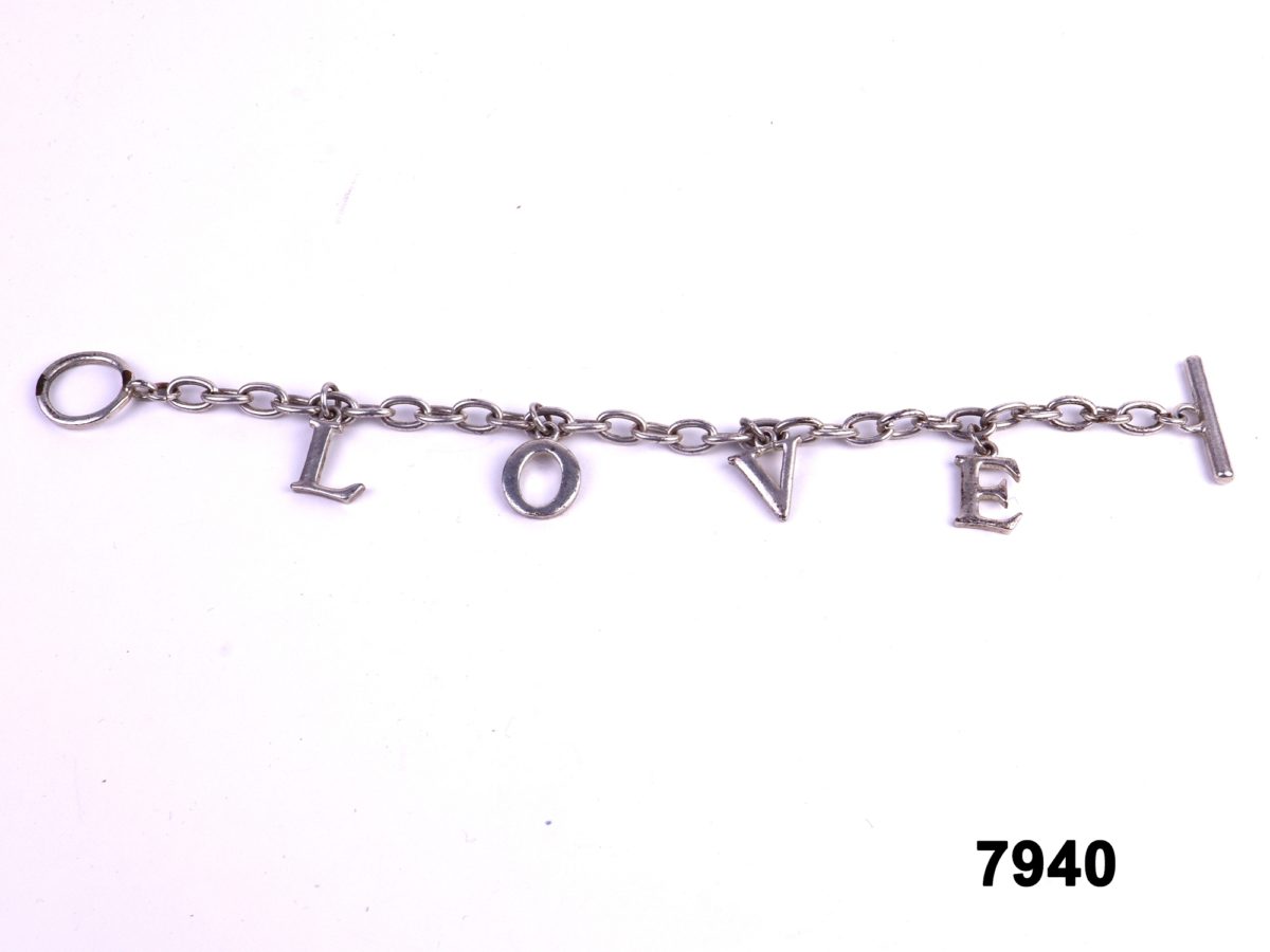 White metal bracelet with letters spelling LOVE from antiques of kingston