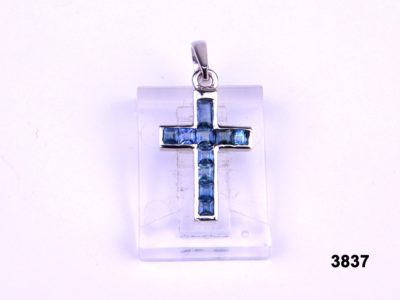 Front view of 18 karat White gold and sapphire cross pendant from Antiques of Kingston