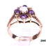 9 carat gold ring set with small opal cabochon to centre with small round cut lilac amethyst stones from Antiques of Kingston