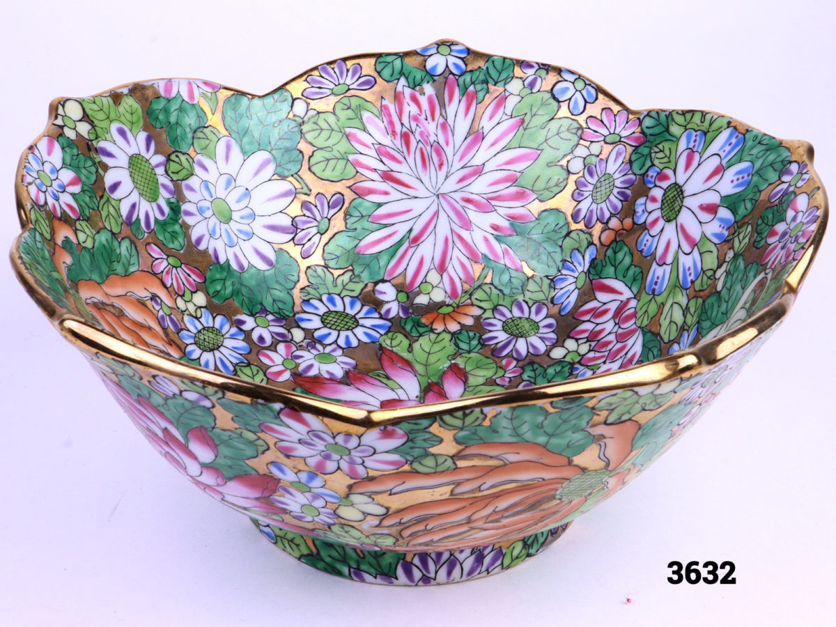 Colourful hand-painted Chinese bowl with chrysanthemums and fluted gilt edge Showing just inside tip of bowl