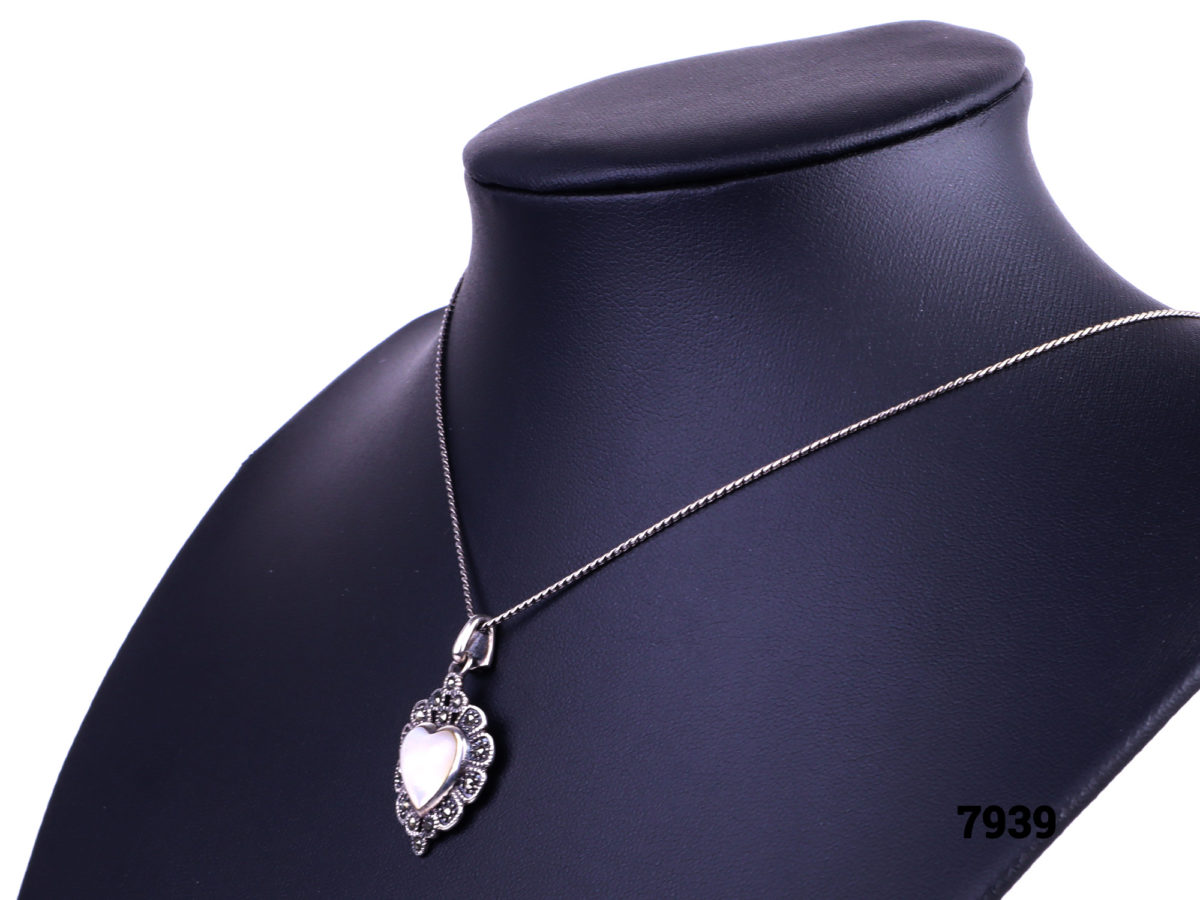 925 Sterling silver necklace with a sterling silver marcasite and white shell heart pendant Image showing side view