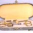Vintage Cased Sewing Set Photo of case with lid open showing interior and contents (2 pairs of gilt handled scissors with signs of wear a gilt thimble and a gilt needlecase)