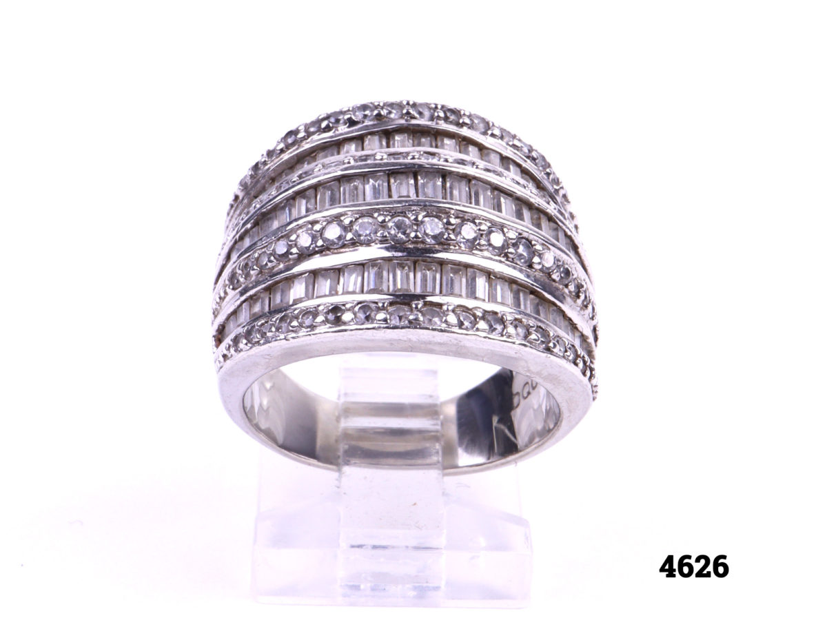 925 Sterling silver ring with alternating layers of round and baguette cut cubic zirconia stones Raised front view