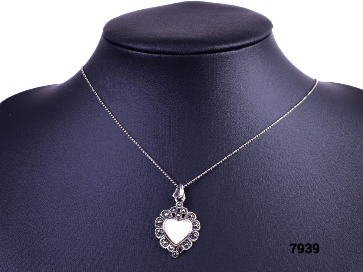 925 Sterling silver necklace with a sterling silver marcasite and white shell heart pendant Main front view image of necklace with pendant