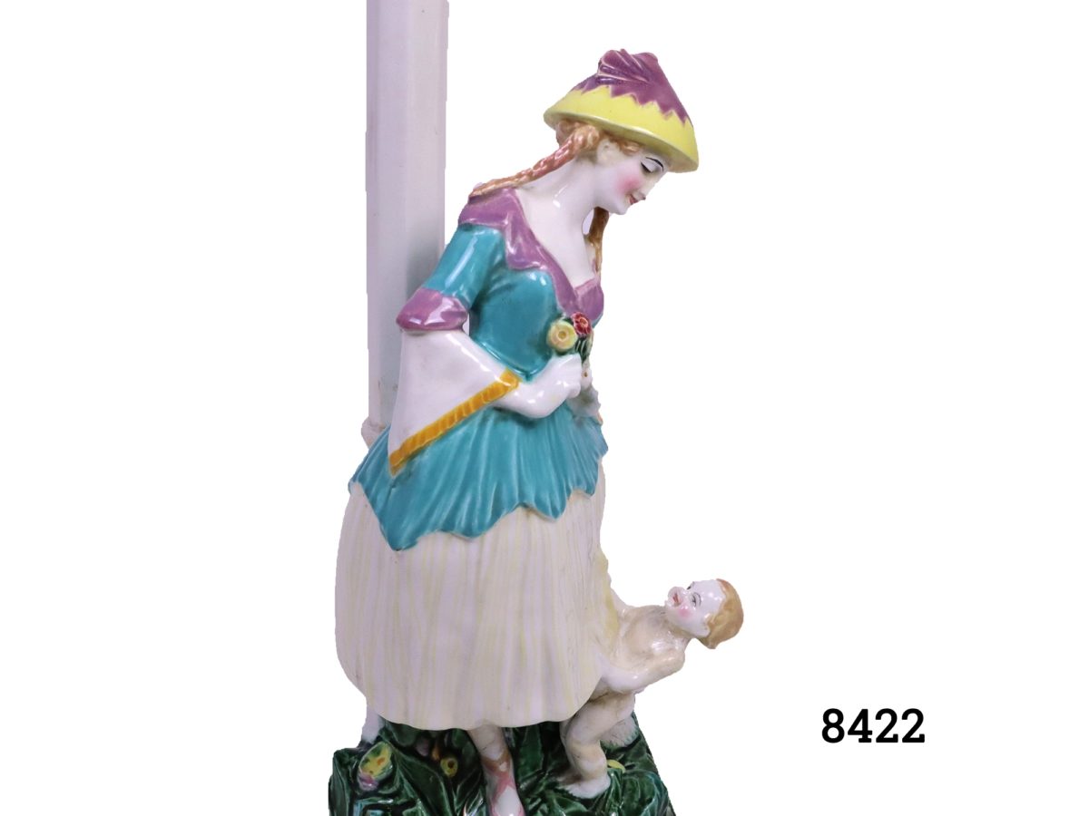 Antique Austrian porcelain lamp stamped Keramos Some early staple restoration work to base and other restoration throughout. Measures 160mm in diameter at base Close up photo of the side view of maiden and child