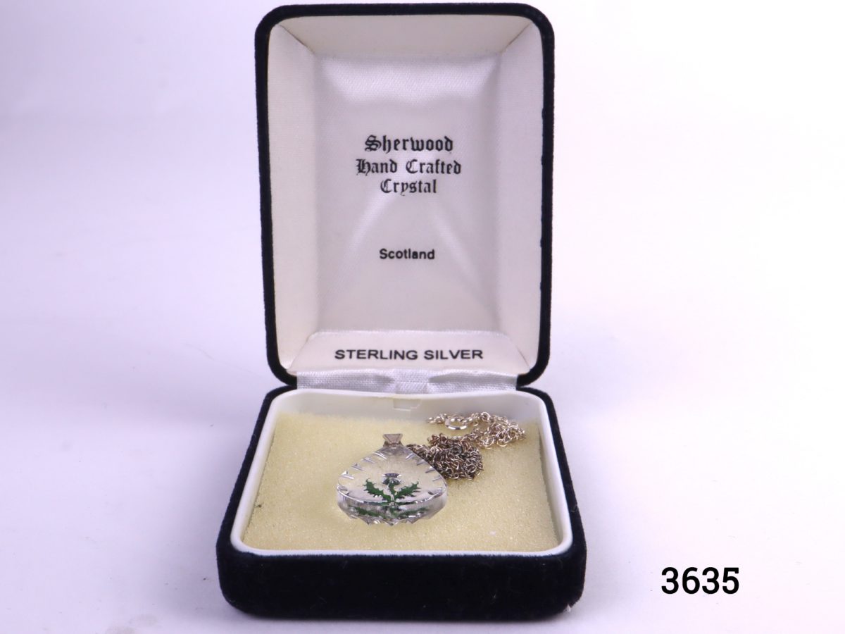 925 Sterling silver chain with handcrafted crystal pendant with thistle in original box Made by Sherwood of Scotland Pendant measures 30mm by 20mm and chain measures 440mm long Photo of necklace in original case