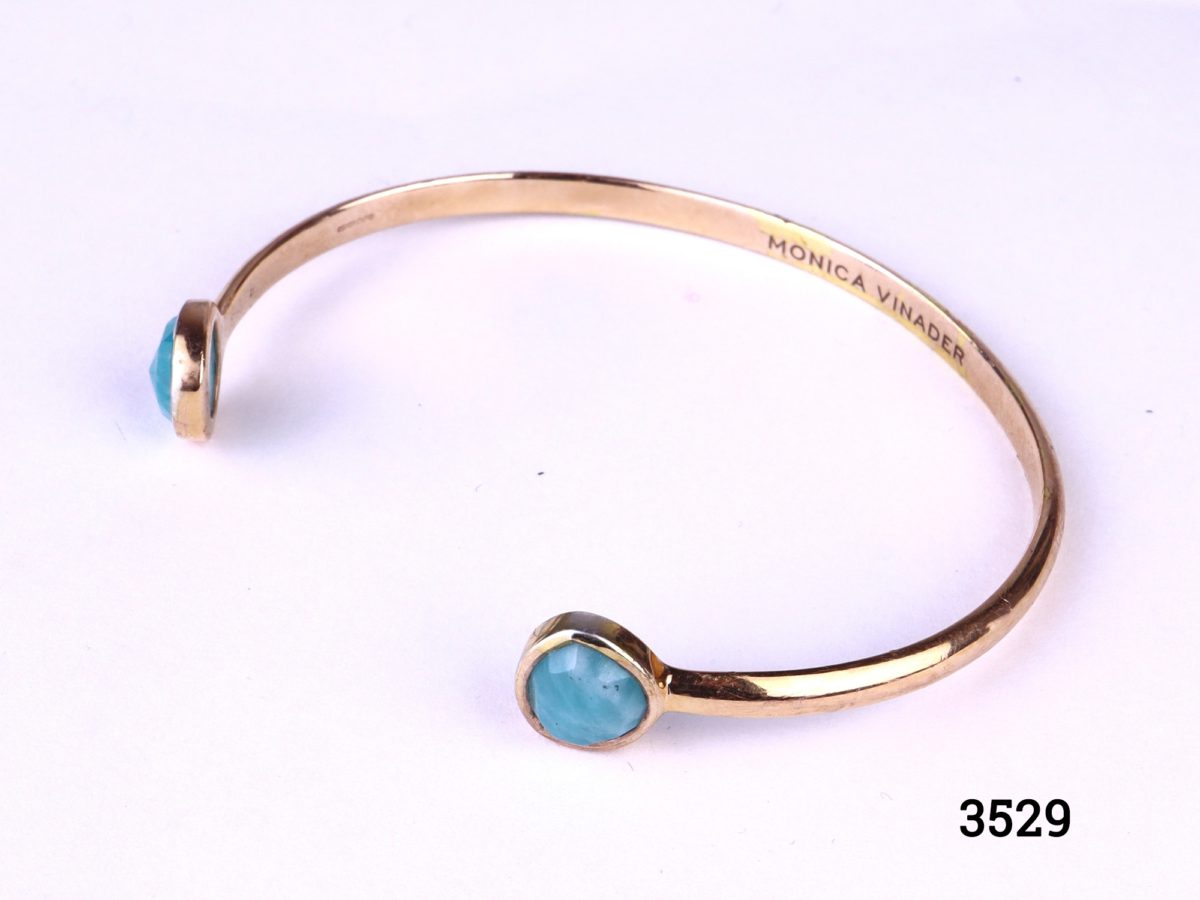 Monica Vinader thin cuff bracelet in 18ct rose gold vermeil on 925 sterling silver with two mutifaceted amazonite stones at both ends Photo of bracelet from a slightly raised side ange