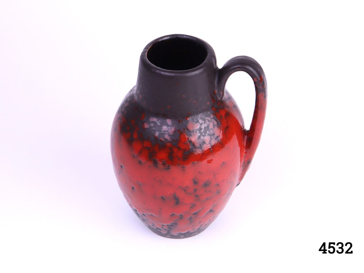 West German Scheurich red & black pottery handled lava vase Stamped W.Germ 474-76 Measures 60mm in diameter at base Photo looking down at jug showing mouth