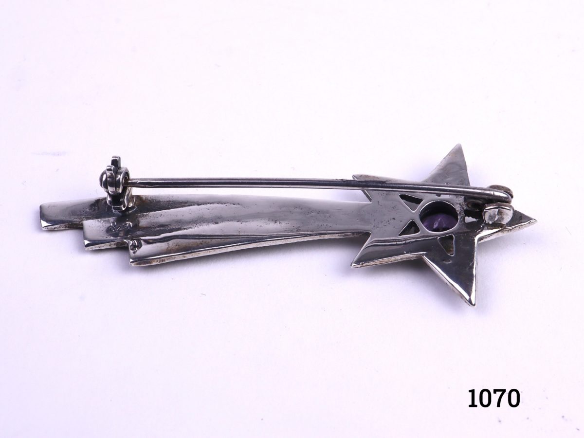 Silver shooting star brooch set with marcasite and small amethyst stone to the centre of the star Hallmarked 925 for sterling silver Photo of the back of brooch