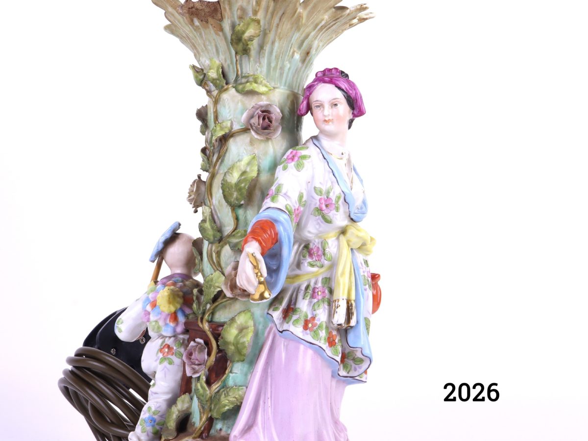 Antique continental porcelain lamp decorated with a woman and child in oriental dress playing around a tree (Some damage as shown - missing leaf) Close up photo of the taller figure