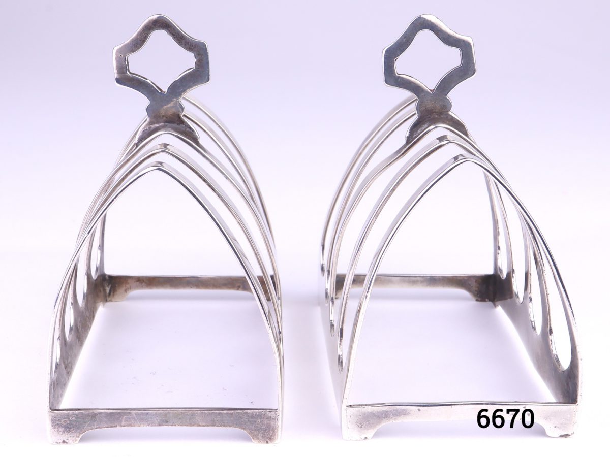 Pair of small 925 sterling silver 4 slice toast racks by E Viners c1936 Each measures 76mm long by 46mm wide by 82mm tall at handle point Photo showing both racks side by side width ways