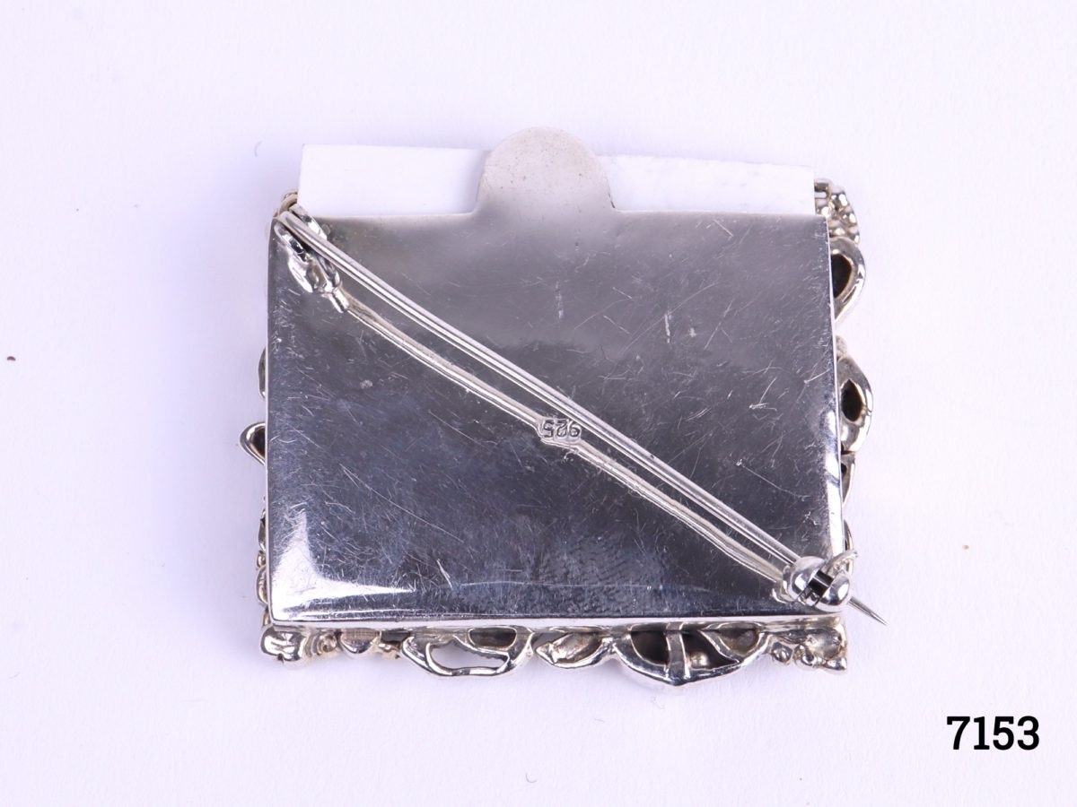 925 Sterling silver picture frame brooch with vine like frame decorated with leaves including onyx, carnelian and Mother Of Pearl (Can be worn as a brooch or pin doubles as a stand to display as a small picture frame) Photo of back of brooch showing diagonal pin