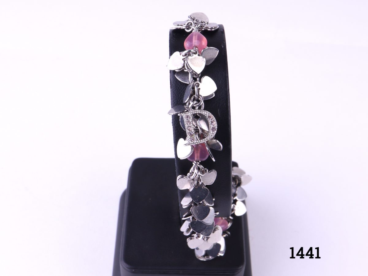 Christian Dior 3 piece set of chrome hearts jewellery Bracelet with rose quartz heart beads adjustable from 160mm to 200mm Photo of bracelet on display stand shoing some lettering and rose quartz hearts