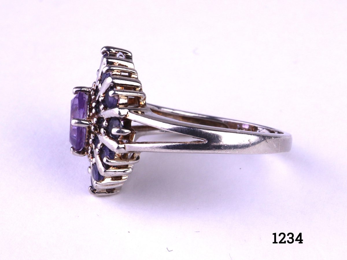 925 Sterling silver ring with princess cut amethyst stone to the centre surrounded by 12 small round lazulite stones Size N / 6.75 Photo showing side view of the ring