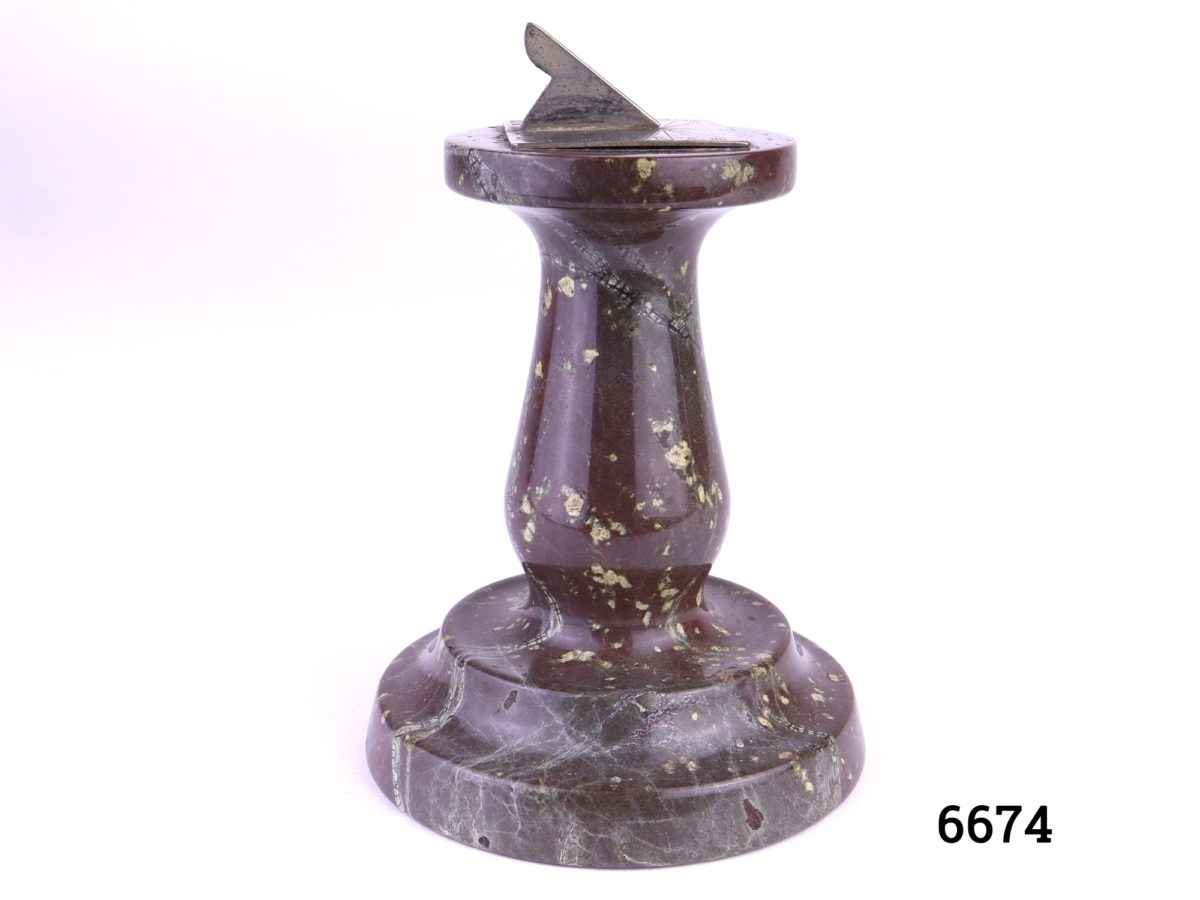 Vintage desktop sundial Small brass sundial set on a reconstituted stone pedestal Measures 75mm in diameter at base Photo showing sundial from a side angle