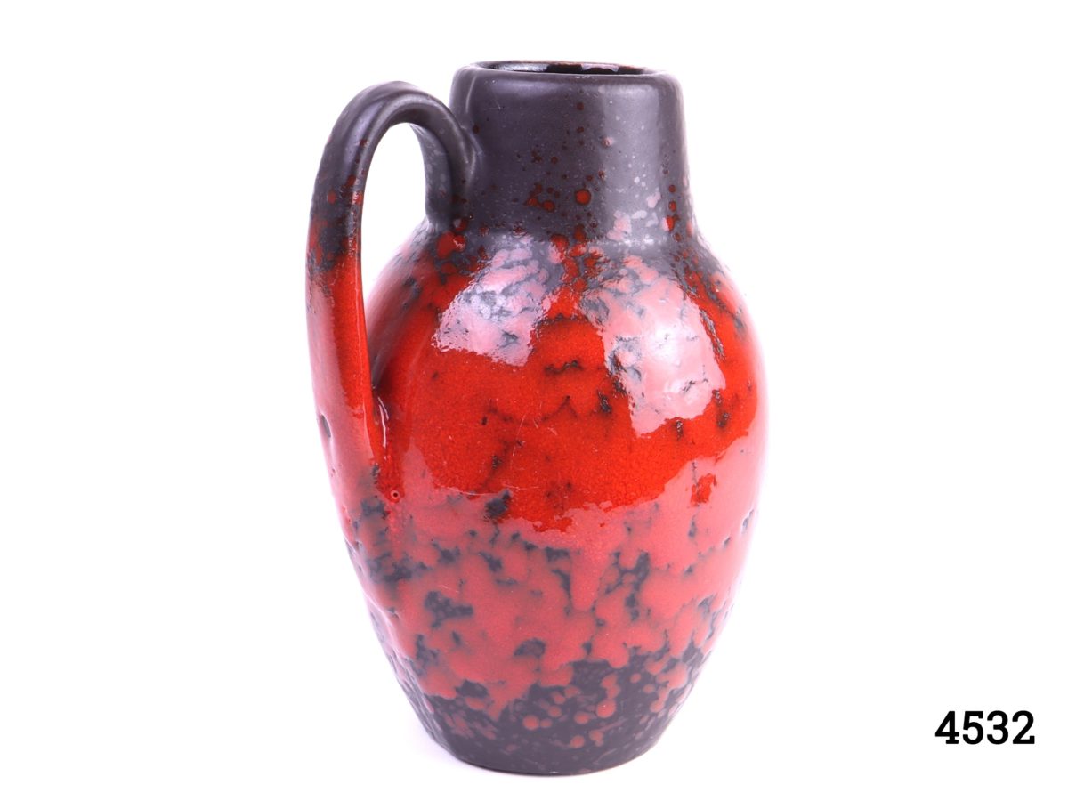West German Scheurich red & black pottery handled lava vase Stamped W.Germ 474-76 Measures 60mm in diameter at base Photo showing vase with handle to the left