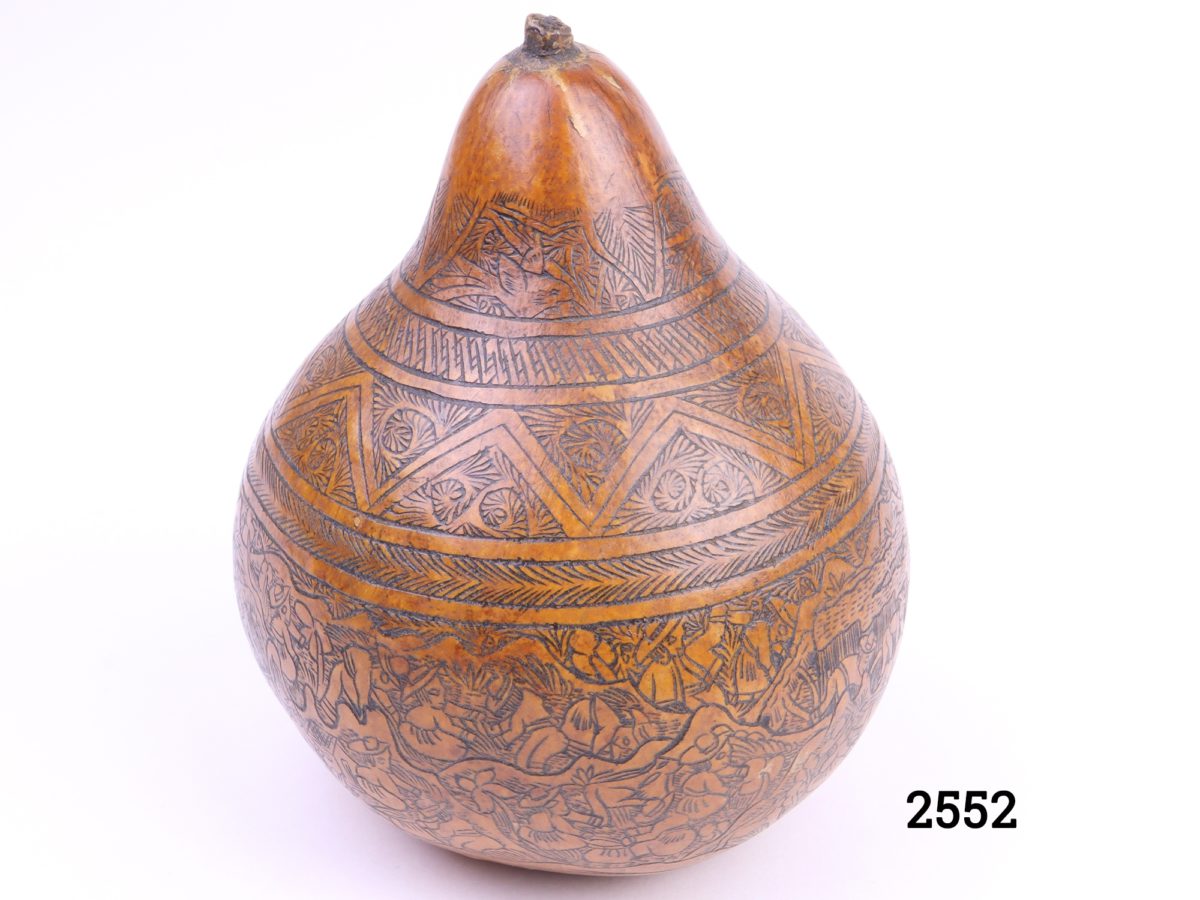Vintage carved African gourd Intricately carved calabash gourd fruit depicting a rural farming scene Measures 65mm in diameter at base Main photo showing one side with some fine carving detail