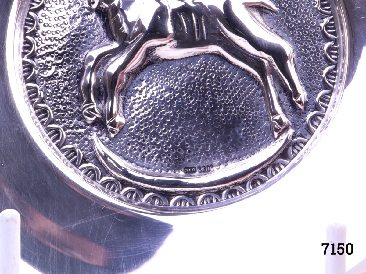 Danish silver pin dish with a figure of a ram to the centre Hallmarked Nrn 830 Measures 97mm in diameter Close up of lower half of dish front with hallmark