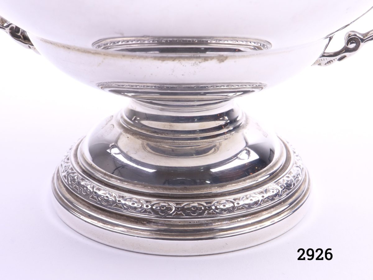 Aspreys two-handled dish Fully hallmarked for sterling silver c1960 Birmingham assayed Measures 55mm in diameter at base and 92mm across top Close up photo of the foot of the dish