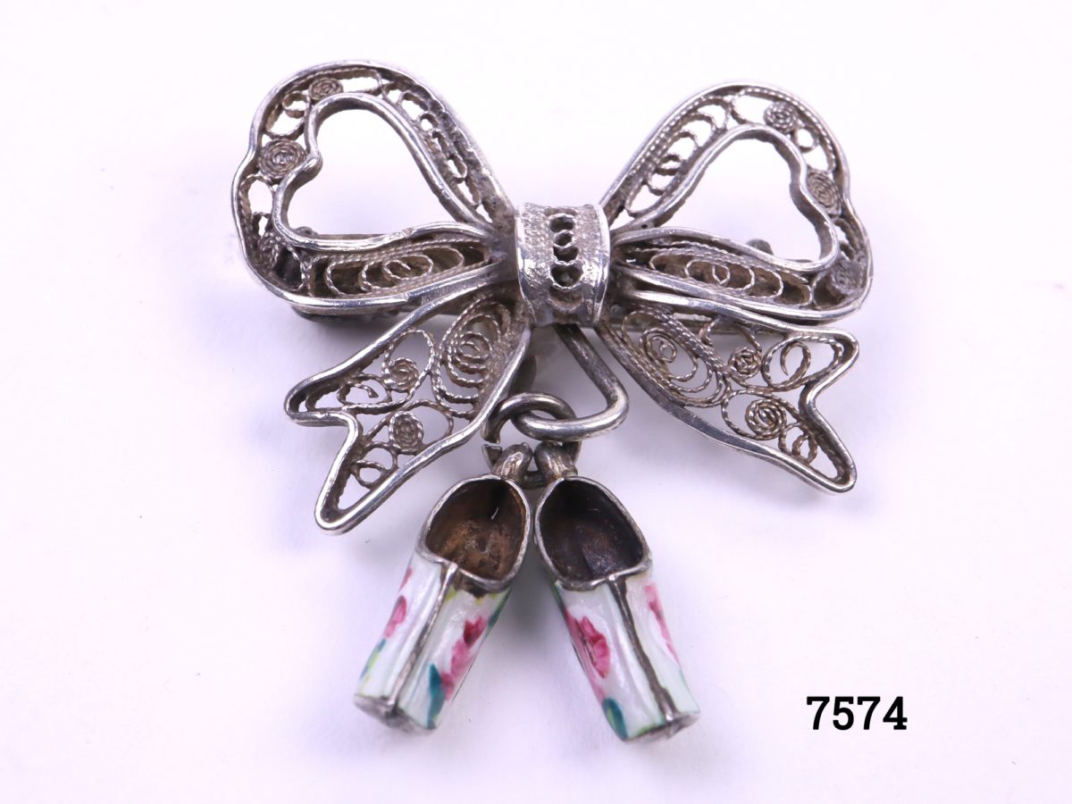 Sterling silver filigree bow brooch with attached pair of silver & enamel white clogs with hand-painted roses to each Another photo of front of brooch with clogs upright