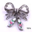 Sterling silver filigree bow brooch with attached pair of silver & enamel white clogs with hand-painted roses to each Main photo showing from of brooch with clogs hanging to the side showing enamelled roses