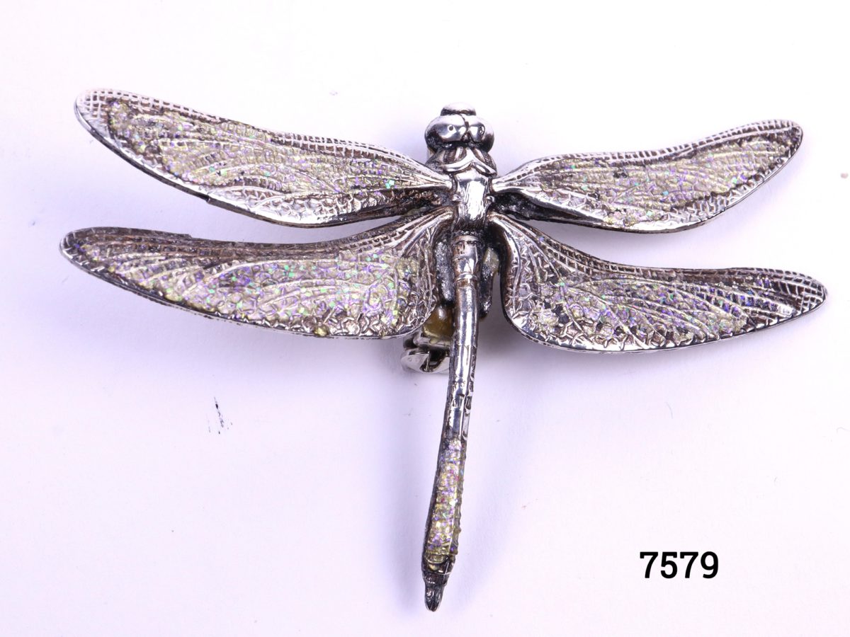 Silver plate dragonfly brooch with iridescent blue and green sparkling wings and tail end Main photo showing brooch front