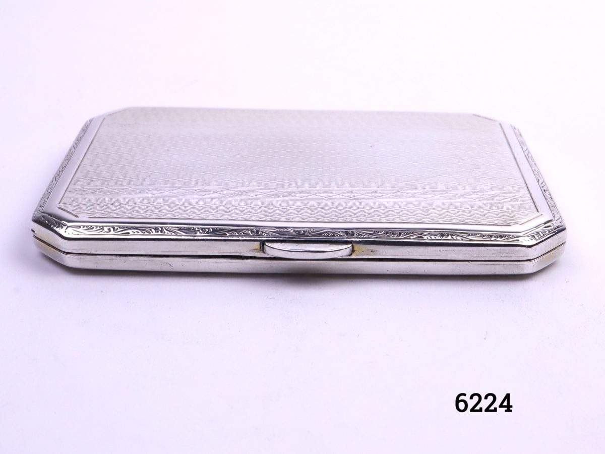 Small silver cigarette case with engine turned design on both sides Made by Turner & Simpson of Birmingham c1930/31 Main photo of case from the front on a flat surface