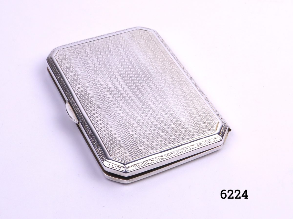 Small silver cigarette case with engine turned design on both sides Made by Turner & Simpson of Birmingham c1930/31 Photo of closed case from a raised side angle