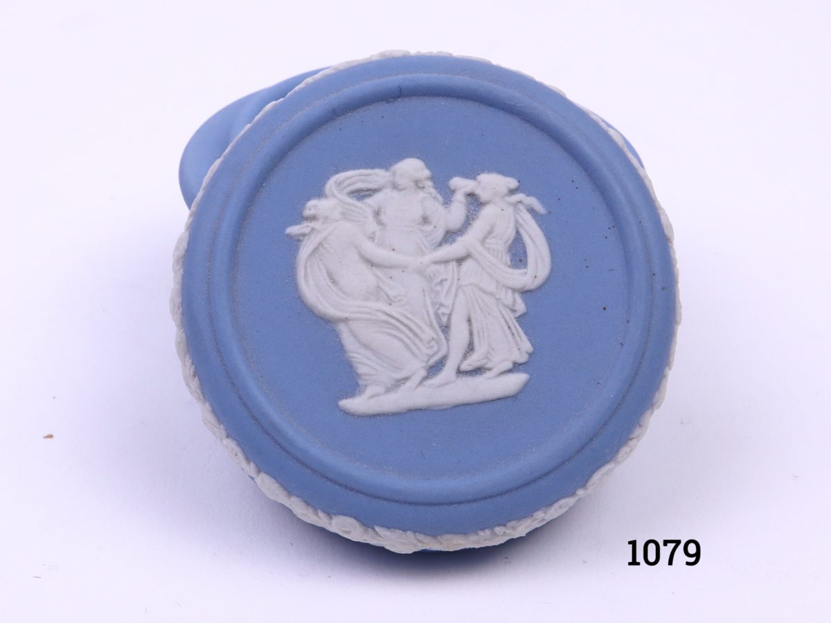 Vintage Wedgwood small lidded pot in the classic Jasperware light blue c1962 Measures 46mm in diameter Close up photo of the lid showing 3 maidens dancing in a circle