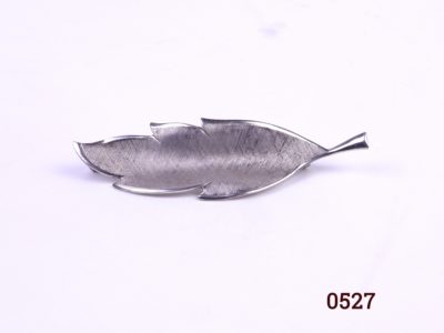 Sterling silver leaf shaped brooch with textured criss-cross textured front Hallmarked silver with additional makers stamp 3747 BT/L Main photo showing the front of brooch other photos showing angled side view and back of brooch with hallmark
