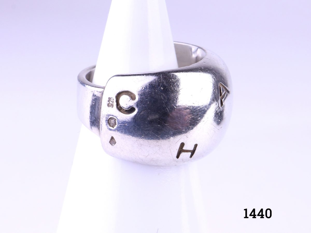925 Sterling silver chunky Chanel ring. Width at front 11mm. Comes with Chanel pouch.  A very small size H / 3.75 Photo showing the Sterling silver hallmark to the left of ring