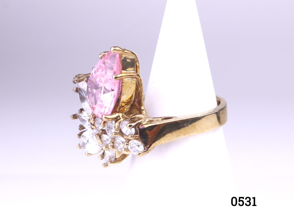 Gold on silver statement ring with pink & white crystals. Ring front measures 20mm by 25mm. Hallmarked 925 for sterling silver. Size K / 5.5   Ring weight 9.7g Photo of ring from a side angle displayed on a stand