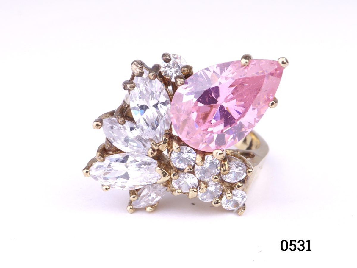 Gold on silver statement ring with pink & white crystals. Ring front measures 20mm by 25mm. Hallmarked 925 for sterling silver. Size K / 5.5   Ring weight 9.7g Photo of front view of ring on a flat surface