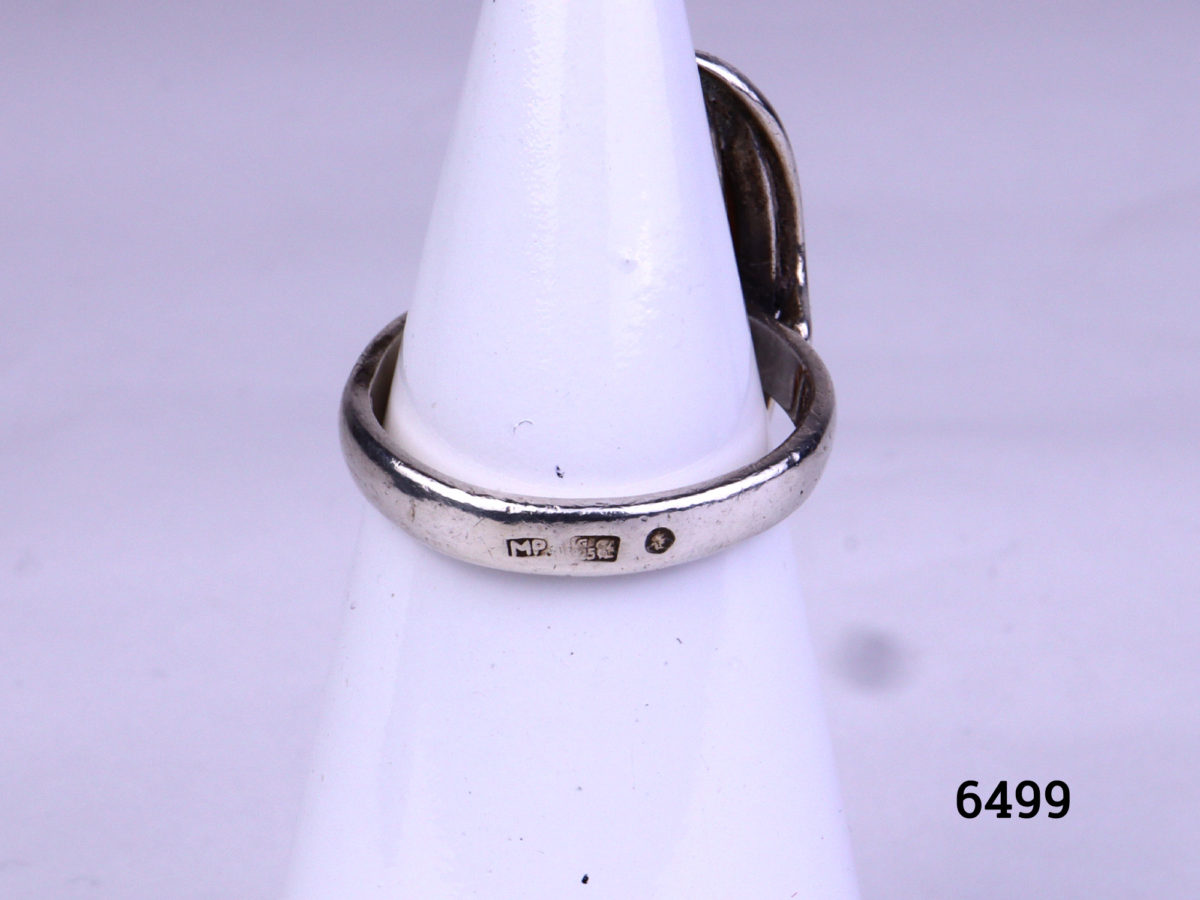 925 Silver ring with Baltic amber stone. Hallmarked on outerband of ring. Made in Gdansk Poland. Size O.5 / 7.5 Ring front measures 30mm x 17mm Photo showing the hallmark on the outerband of the ring