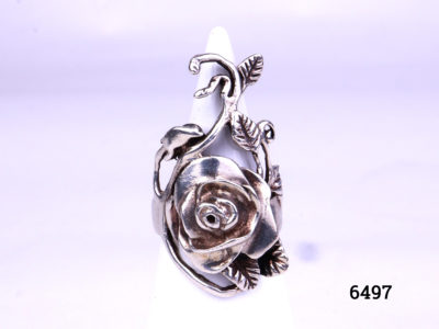 925 Silver rose flower ring. Hallmarked 925 for sterling silver. Size K.5 / 5.5. Ring front measures 35mm long by 20mm wide. Main photo showing front view of ring displayed on a stand.