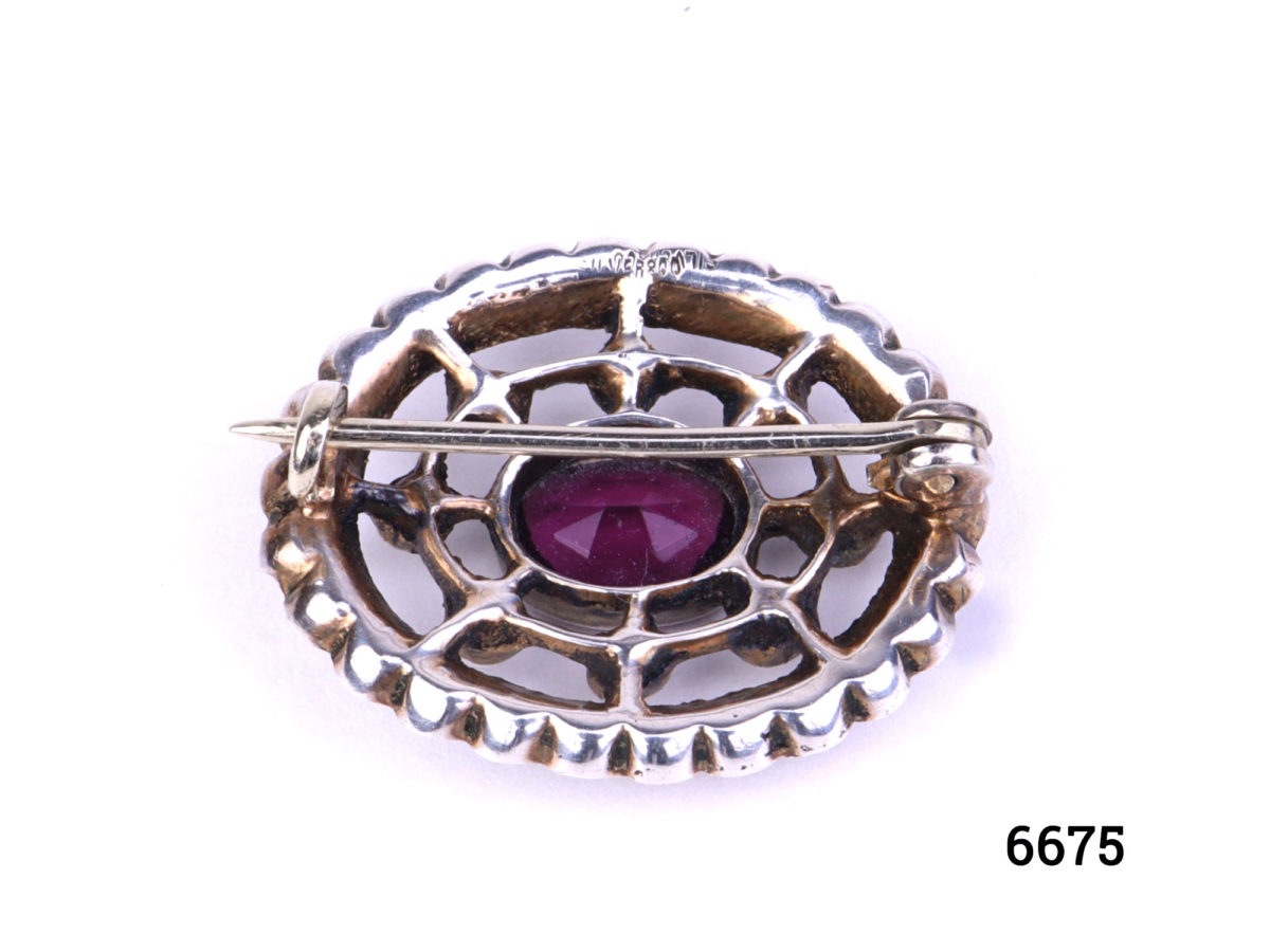 Vintage Continental silver brooch with oval cut amethyst to the centre surrounded by rhinestones. Hallmarked 800 silver. Brooch weighs 4.8grammes and measures 25mm by 20mm Photo of back of brooch