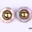 Ermani Bulatti clip-on earrings. Vintage gilt metal circular clip-on earrings with a raised round mound to centre surrounded by inlaid mother-of-pearl (Some gilt wear to centre at front and back). Measures 25mm in diameter Main photo showing front view of both earrings
