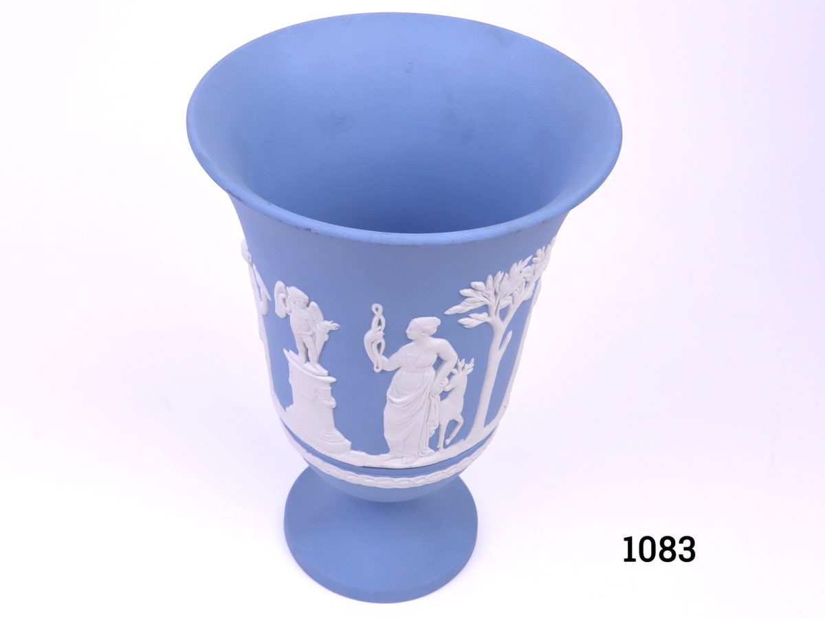 Vintage Wedgwood Jasperware vase in the classic light blue c1975 Measures 76mm in diameter at base and 130mm in diameter across the top Photo showing vase from a slightly raised angle peering into the centre