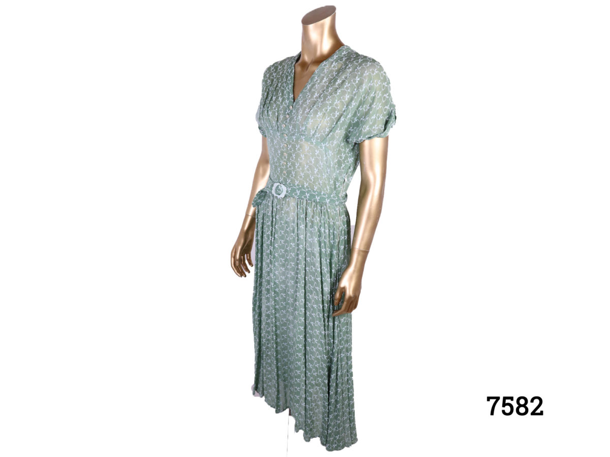 Vintage 40s style green silk voile dress with emroidered pattern throughout Side zip Size 10-12 Photo of dress from a side angle
