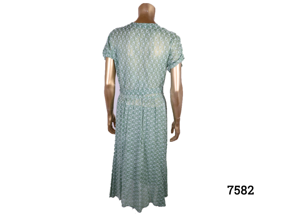 Vintage 40s style green silk voile dress with emroidered pattern throughout Side zip Size 10-12 Photo of back of dress