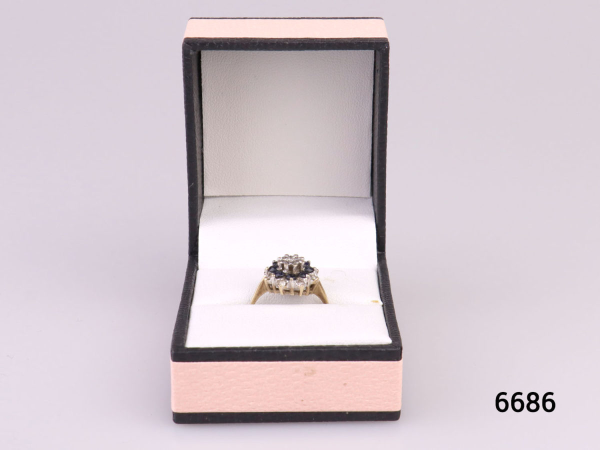 c1976 London assayed 9 karat gold ring with diamonds and sapphires. Fully hallmarked. Size K / 5 Weight 2.7g Photo of ring in box